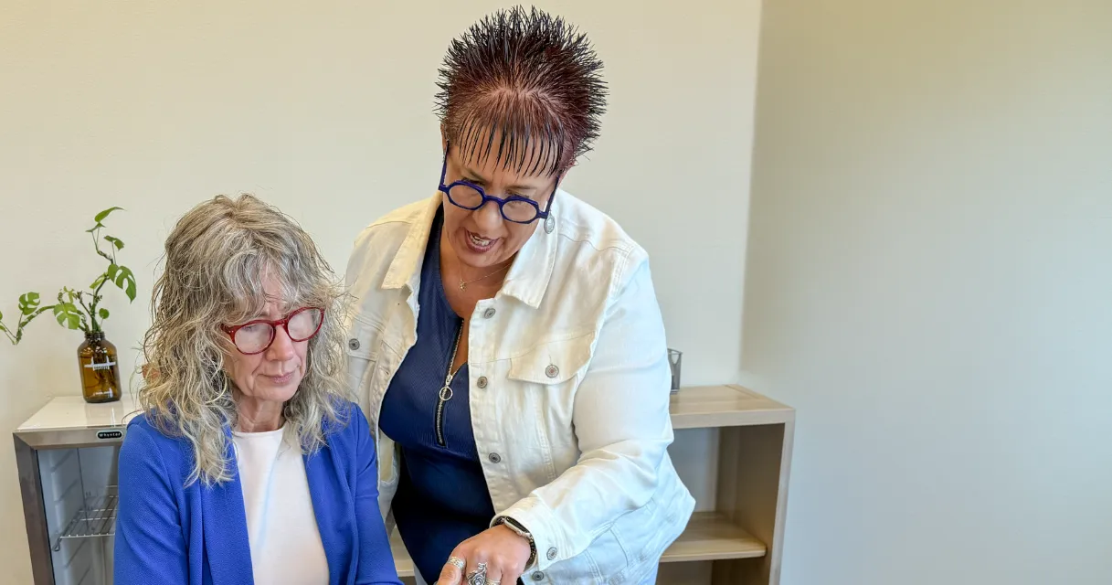 Tami Levin and a business client looking at a document together